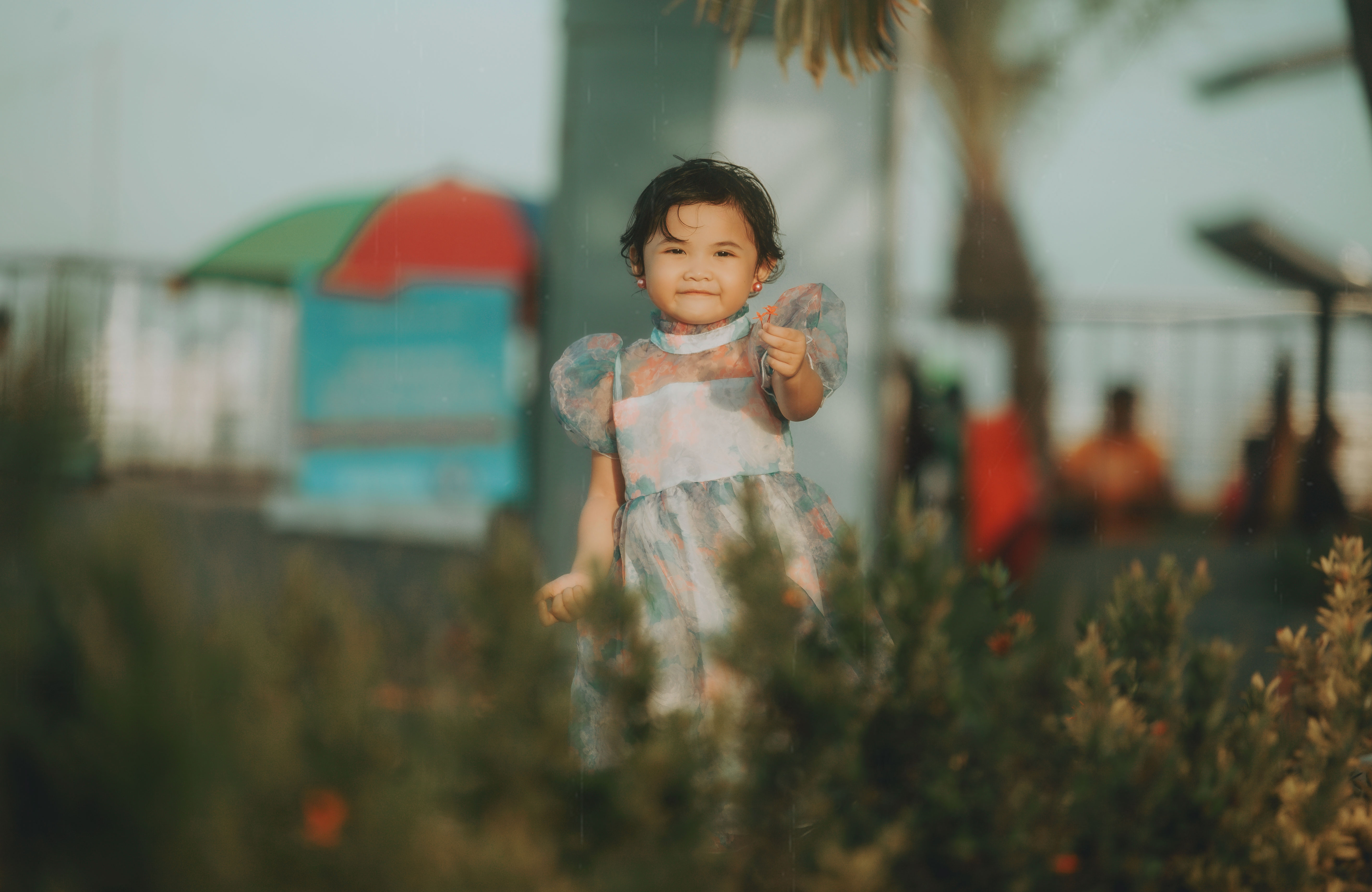 Child in blue/pink dress